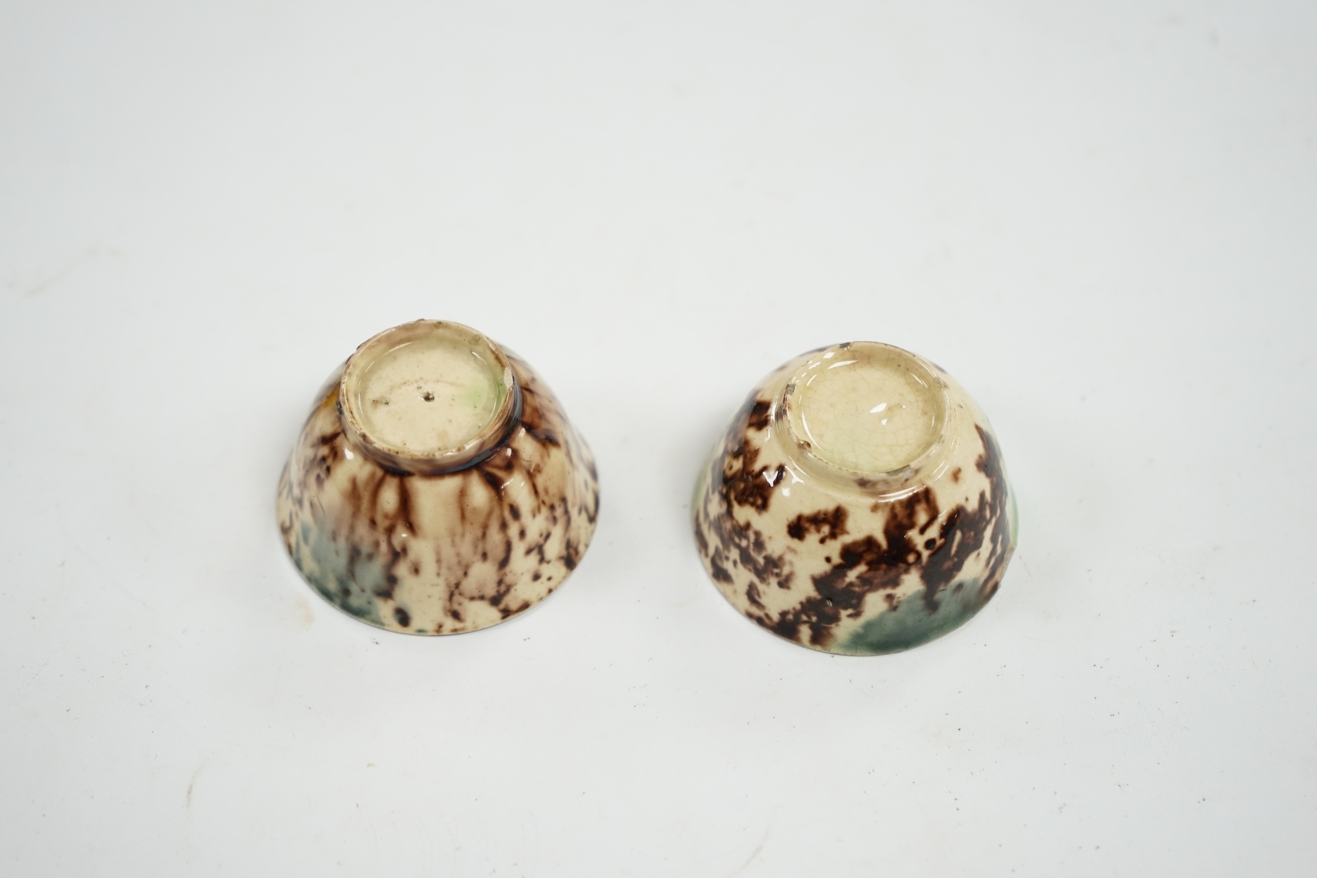 A pair of 18th century Whieldon-type miniature bowls, top rim 4.5cm diameter. Condition - some small chips to base